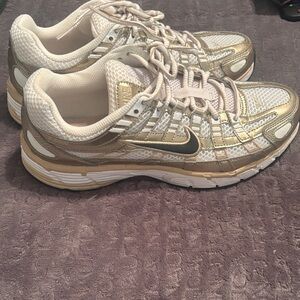 Nike Women's Metallic Gold and Cream Sneakers